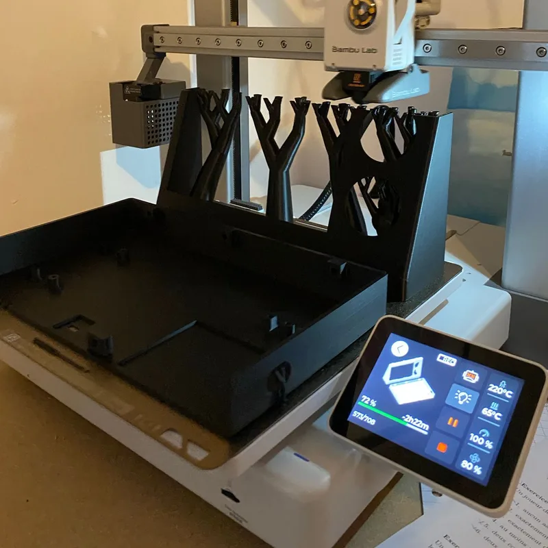 3D printing Orion’s case in black PLA on the BambuLab A1, the printer screen showing 72%
